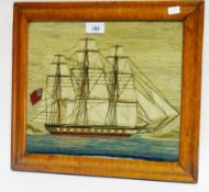 Early 19th century wool and silk work picture of British sailing galleon in harbour, in bird's eye