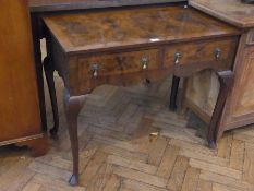 A reproduction figured walnut lowboy with two frieze drawers, drop handles, on cabriole supports,