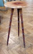 Late nineteenth century mahogany plant stand with moulded edge on ring turned splayed legs, diameter