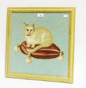 Woolwork tapestry picture, cat seated on tasselled cushion
