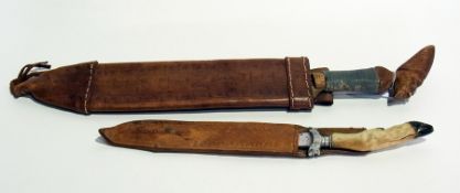 Souvenir knife from Trinidad with carved head handle and another continental knife with animal