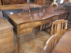 An Edwardian mahogany bow-fronted sideboard, with an arrangement of five drawers, brass swan-neck