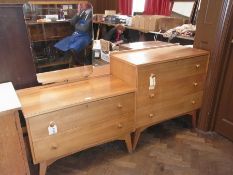 A 1960's walnut mirror back dressing table with two long drawers on splayed square tapering legs