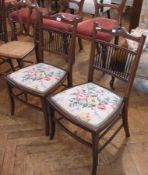 A pair of Edwardian mahogany bedroom chairs, slat-back, with upholstered seat, on splayed