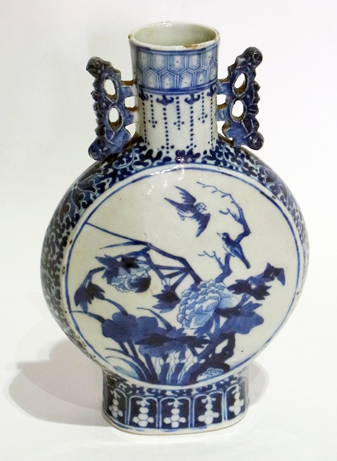 An oriental blue and white moon flask vase, 25cm high
