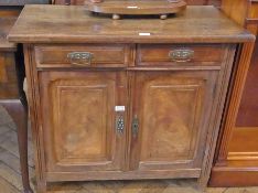 An Edwardian mahogany sideboard, two drawers and panelled cupboard enclosing shelving space, on