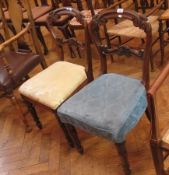 A pair of Victorian rosewood dining chairs, each with scroll carved back, anthemion cross rail, on
