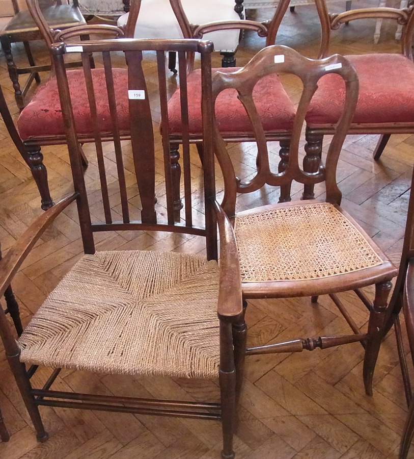 A mahogany rush-seated elbow chair, comb-back, rush-seat, on straight supports and stretchers and