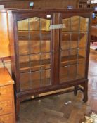 Twentieth century oak bookcase, the pair of glazed leaded light doors enclosing adjustable