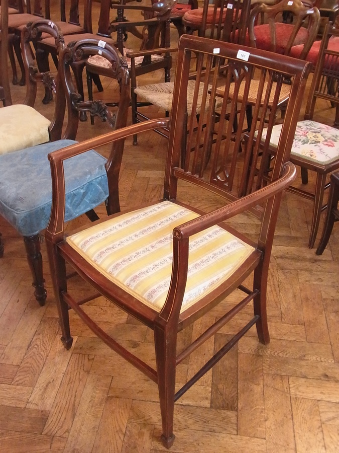 An Edwardian inlaid open armchair with rail-back, chequered inlay,  padded seat, on spade