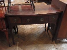 A 20th century mahogany bow-fronted sideboard with three drawers, on tapering supports (af), 103cm