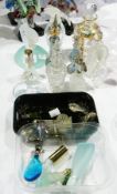A collection of variously cut, enamelled, metal-bound and shaped scent bottles, principally glass