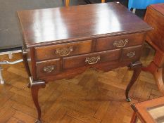 Georgian style oak lowboy with moulded edge top, with an arrangement of five frieze drawers on