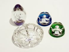 A pair of Wedgwood sulphide-type cut glass paperweights of Queen Elizabeth and Prince Charles, a cut
