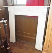 A white painted fire surround