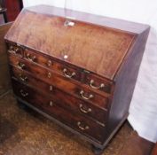 Georgian oak bureau, the fall front enclosing central cupboard flanked by pigeon holes and small