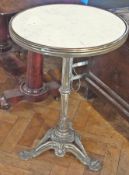 Brass, white and grey marble-topped table, circular, on brass reeded column and ornate scroll tripod