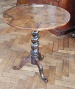 19th century figured walnut and stained wood tripod occasional table, the quarter veneered