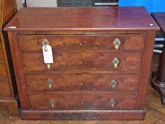 Mahogany chest of four long graduated drawers with engraved brass drop handles and shaped oval