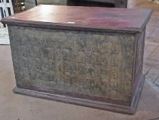 An old Asian painted and relief-decorated box, with panel front of gilt painted relief Hindu gods