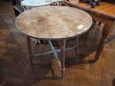 Pine circular kitchen table, on turned supports united by stretchers, 89cm wide