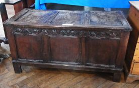 Antique oak coffer with triple-framed panelled top and front, with lunette carved frieze, on stile