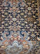 Persian style wool runner, blue ground with central medallions in orange, blue and green, 80cm x