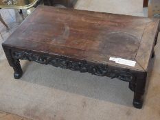 An oriental hardwood rectangular topped occasional/coffee table, foliate pierced decoration, on