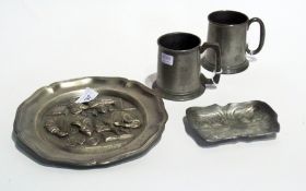 Two pewter tankards, a French pewter plate with money counters and an Art Nouveau style dish (4)