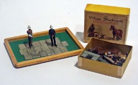 Miniature models of Village Blacksmith No.169, boxed together with a Royal Marine Band master and