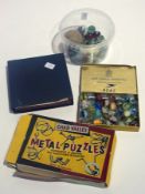 Marbles, two scrap books, "Brightway" jigsaw, metal puzzle etc (1 box)