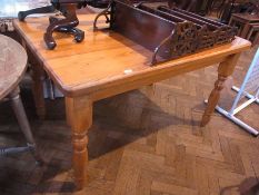 A modern pine rectangular-topped kitchen table on turned supports, 136cm wide