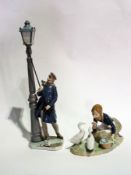 Lladro figure "The Lamp Lighter", man with cap and scarf lighting street lamp and another Lladro