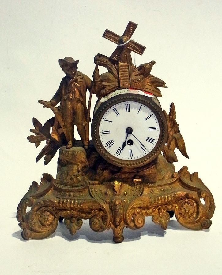 A late nineteenth century French mantel clock with enamel dial, gilt metal case depicting
