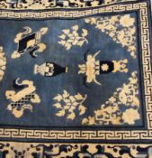 Modern Oriental style runner in navy and light blue with urn pattern to centre and floral borders,