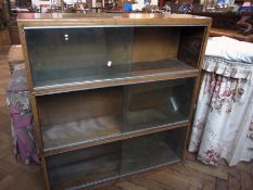 Modern oak three-tier bookcase with glass sliding doors, 89cm wide