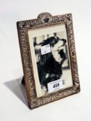 Silver photograph frame having repousse scroll decoration, rectangular, marks indistinct