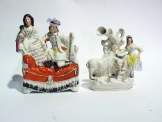 Staffordshire flatback reclining figure group of lady holding parrot and Staffordshire spill vase