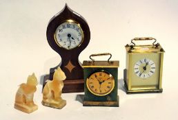 Two brass mantel clocks, a teak cased mantel clock, an onyx cigarette box, ashtray, egg and