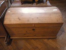 A pine domed-top coffer, hinged lid with small wood handle, 111cm wide