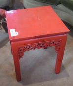 An oriental red lacquered square-top occasional table, on straight supports, 43cm wide