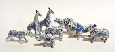 A quantity of blue and white tinglaze pottery animals including giraffes and elephants