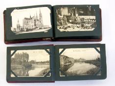 Two albums of WWI related postcards to include:- various bombed ruins, cannons, submarine mines,