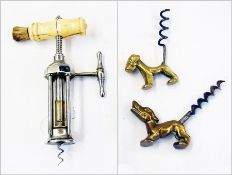 A brass corkscrew in the shape of a dog, another and a bone handled corkscrew (3)   Condition Report