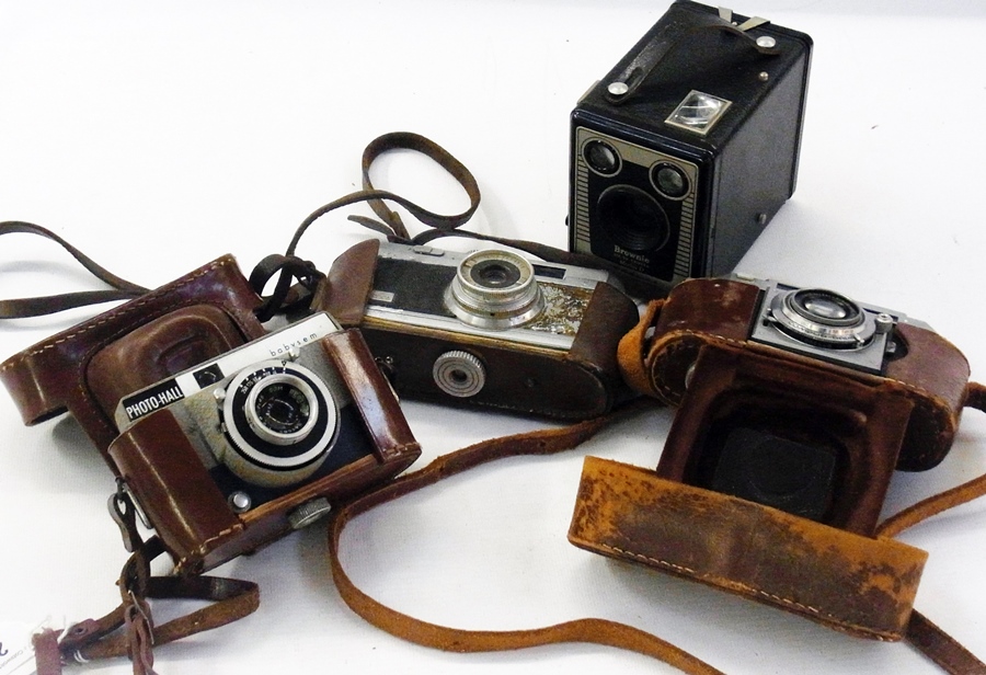 A Photo-Hall Baby Sem camera in case, Opla 1:1:35 camera, an Agfa Compuri rapid camera in case, a