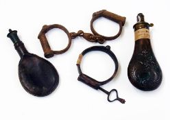 Two powder flasks and handcuffs, etc. (5)    Condition Report  Please contact the Auctioneer for