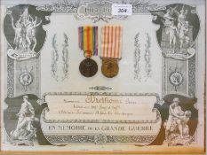 Four WW I French framed certificates of service including one with two WWI French medals (4)