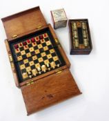 Victorian travelling miniature chess box, a small games box and a Chinese "Wonder cube" (3)