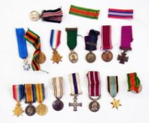 Sixteen WW I and WW II miniature military medals (1 box)    Condition Report  Please contact the