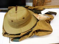 A WWII kit bag, a WWI bayonet, pith helmet and motor fuel ration book   Condition Report  Please